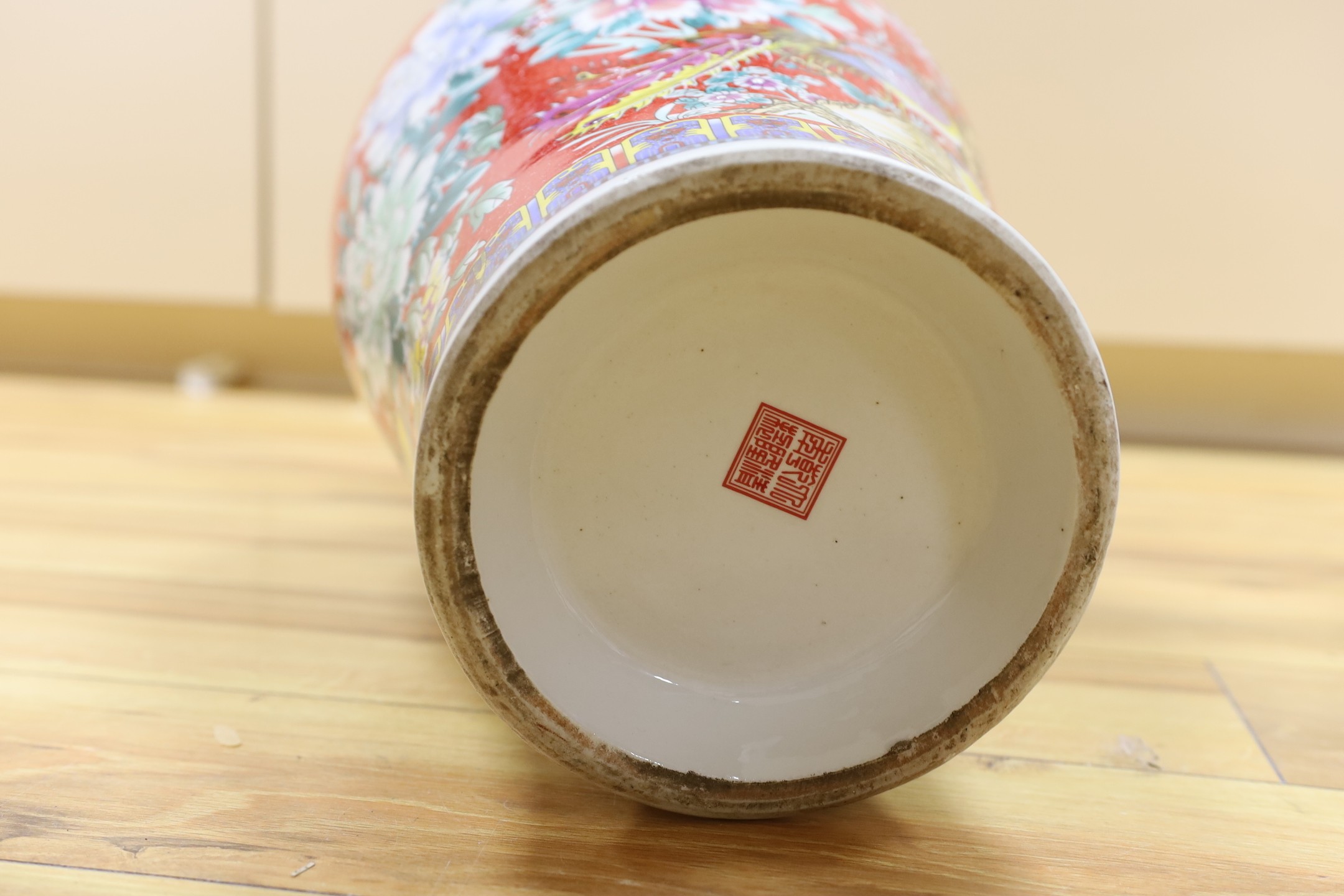 A large modern red ground Chinese vase with floral decoration - 68.5cm tall